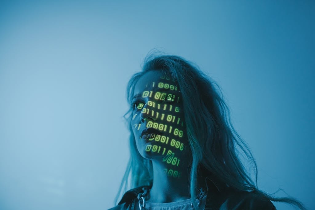 A woman with binary code lights projected on her face, symbolizing technology and project amelia